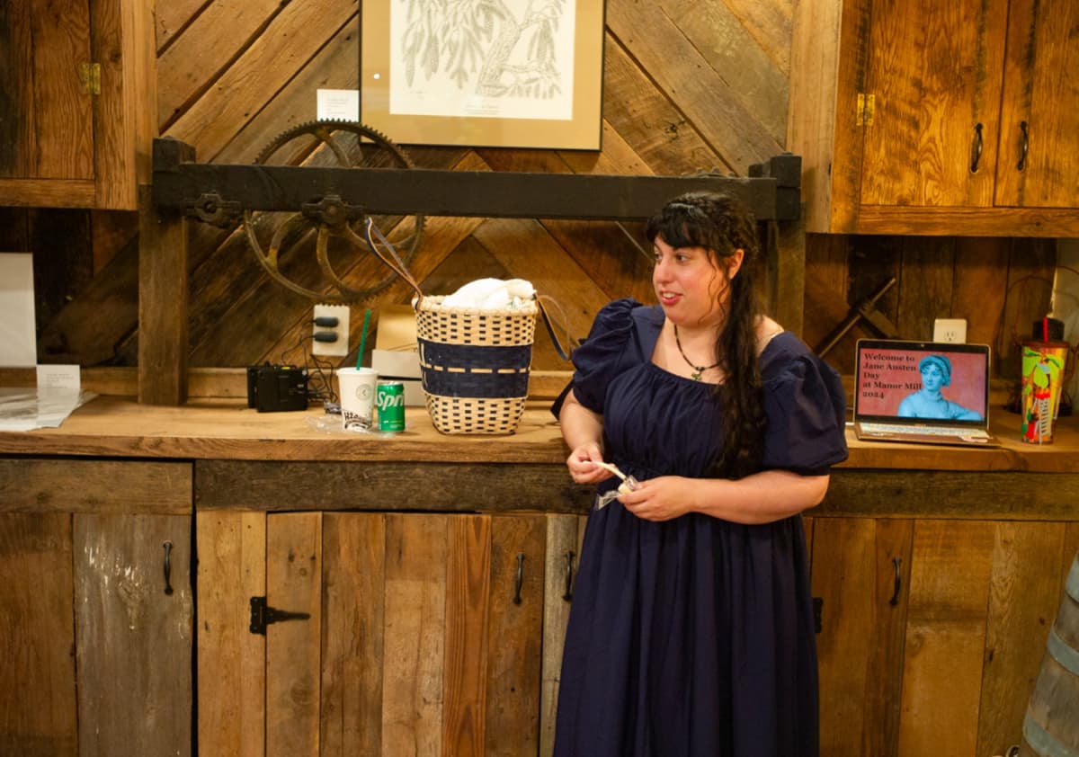 Presenter in Regency dress at Manor Mill